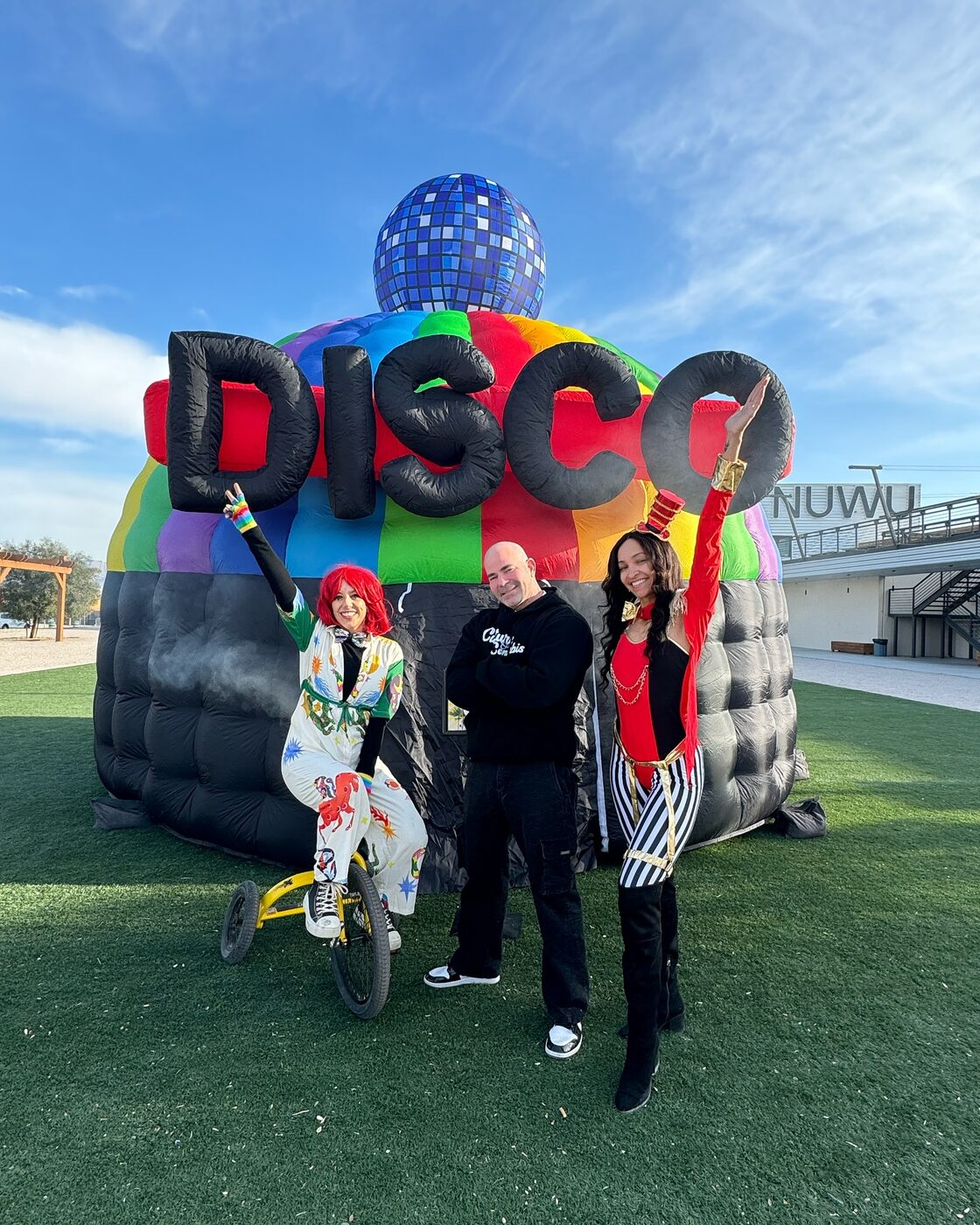 Guests gather by the inflatable disco dome installation