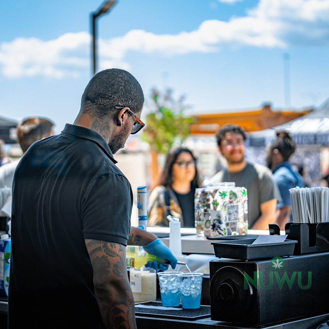 A cannabis brand activation booth on the courtyard